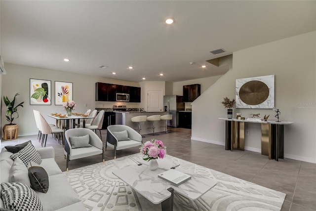 33351 Apricot Tree Ct, Wesley Chapel, FL 33543 - living area with recessed lighting and light tile patterned flooring