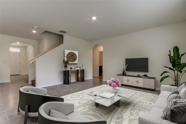 33351 Apricot Tree Ct, Wesley Chapel, FL 33543 - living area with arched walkways, stairway, and recessed lighting