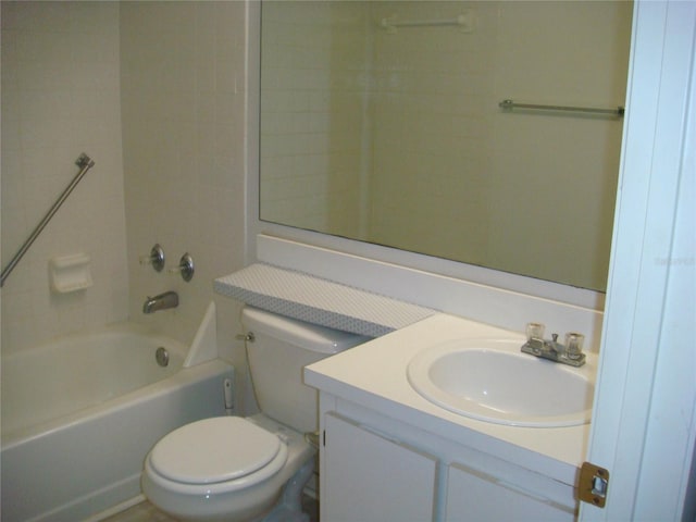 full bathroom featuring vanity, tiled shower / bath combo, and toilet