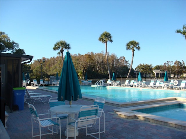 view of swimming pool with a patio area