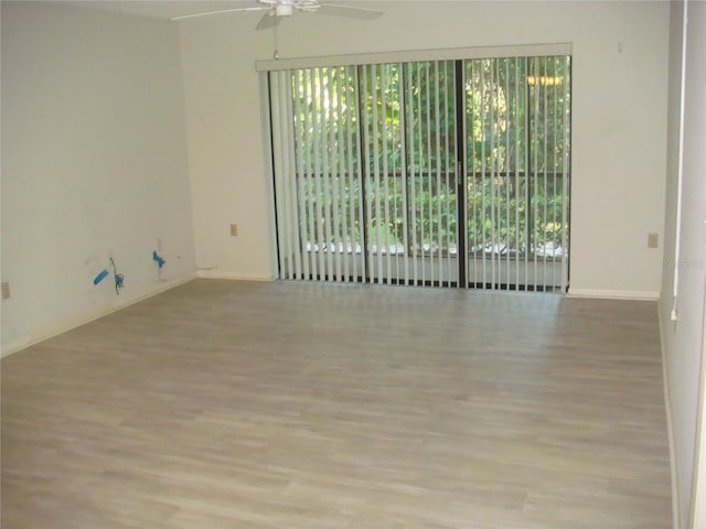 unfurnished room with ceiling fan and light hardwood / wood-style floors