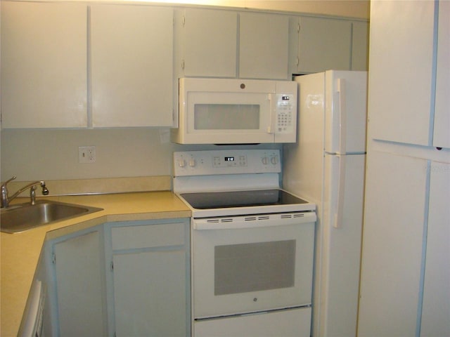 kitchen with white appliances and sink