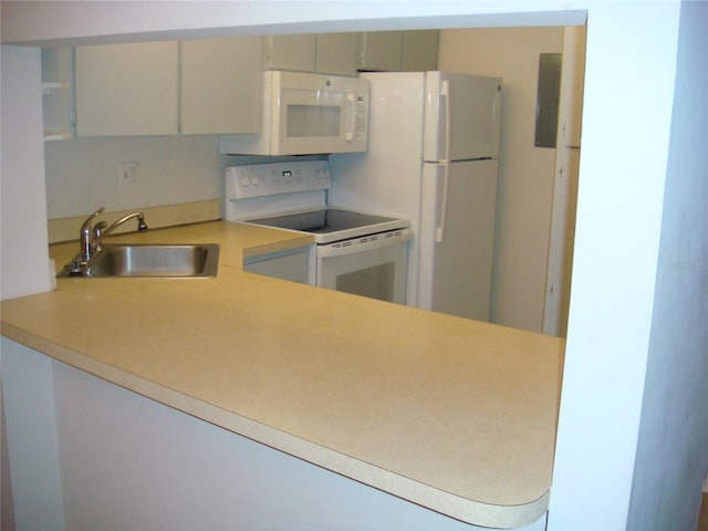 kitchen featuring sink and white appliances