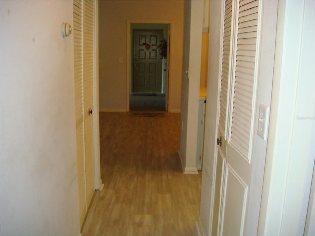 hallway featuring light hardwood / wood-style flooring