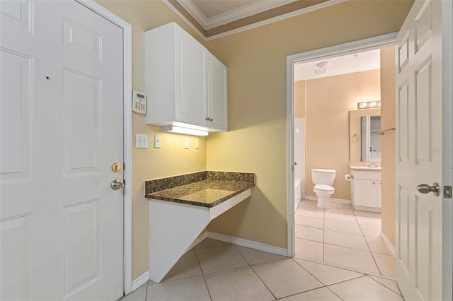 bathroom with vanity, tile patterned floors, toilet, and ornamental molding