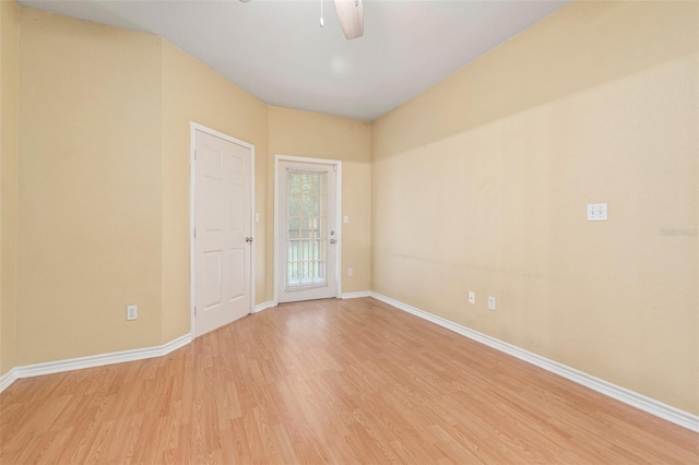 empty room with ceiling fan and light wood-type flooring