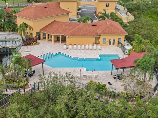 view of swimming pool with a patio