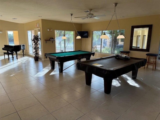 game room with tile patterned flooring, plenty of natural light, and pool table