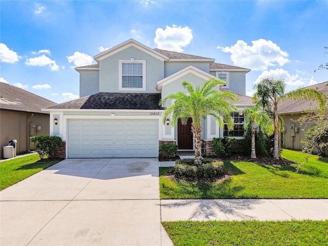 view of front of home with a garage and a front yard