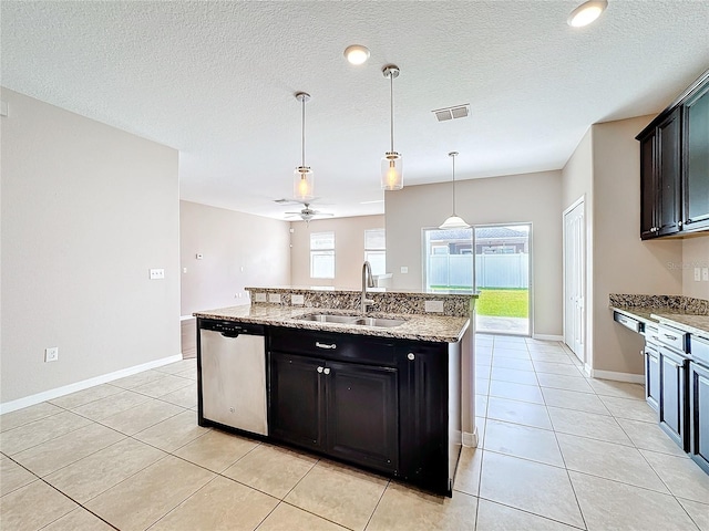 kitchen with hanging light fixtures, sink, dishwasher, ceiling fan, and a kitchen island with sink