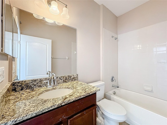 full bathroom featuring vanity, toilet, and tiled shower / bath combo