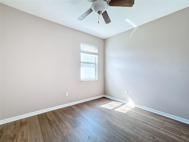 spare room with hardwood / wood-style flooring and ceiling fan