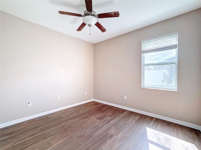 unfurnished room with hardwood / wood-style floors and ceiling fan