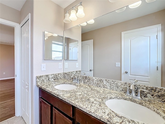 bathroom featuring hardwood / wood-style floors and vanity