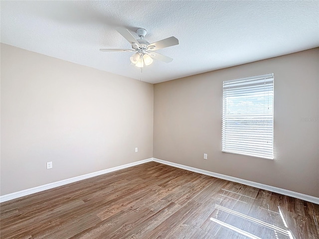 unfurnished room featuring a textured ceiling, hardwood / wood-style flooring, and ceiling fan