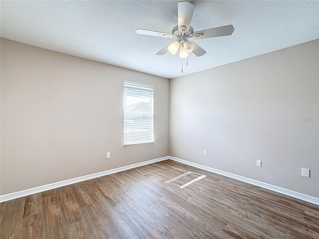 unfurnished room featuring hardwood / wood-style floors, ceiling fan, and a textured ceiling