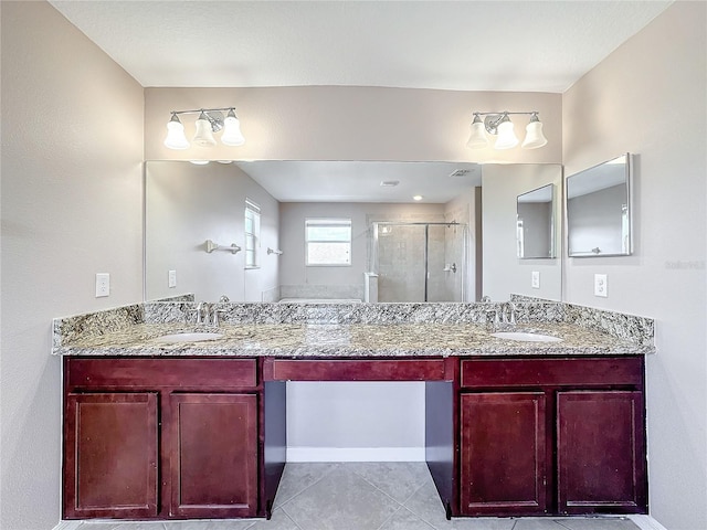 bathroom with walk in shower, tile patterned flooring, and vanity