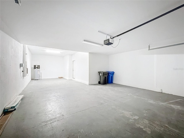 garage with a garage door opener and water heater