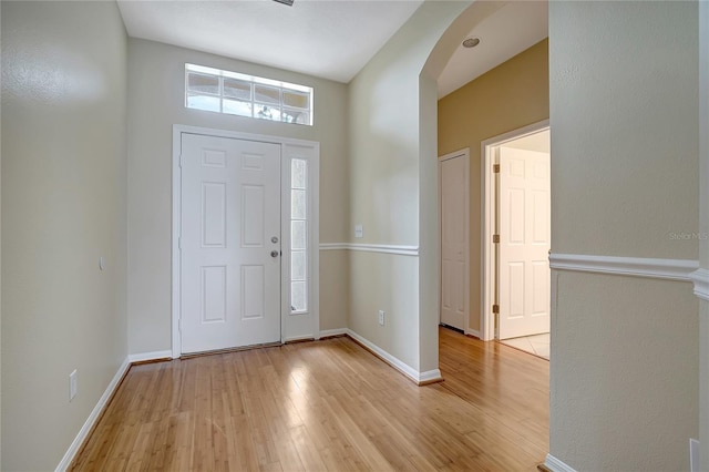 foyer entrance with light hardwood / wood-style floors