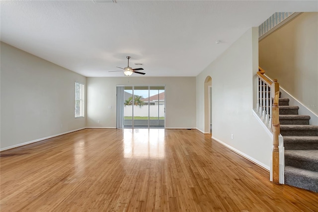 interior space with light wood-type flooring and ceiling fan