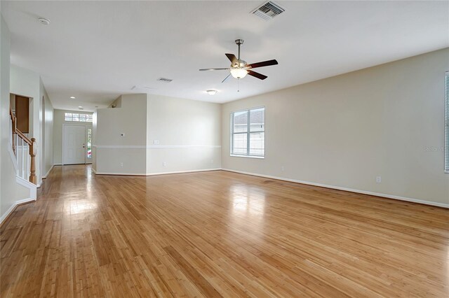 empty room featuring light hardwood / wood-style floors and ceiling fan