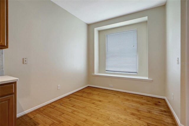 unfurnished dining area with light wood-type flooring