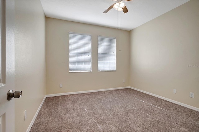 unfurnished room with carpet and ceiling fan