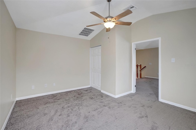 unfurnished bedroom with ceiling fan, light carpet, and vaulted ceiling