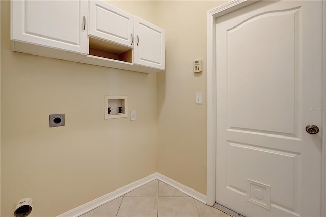 laundry area featuring cabinets, hookup for an electric dryer, washer hookup, and light tile patterned floors