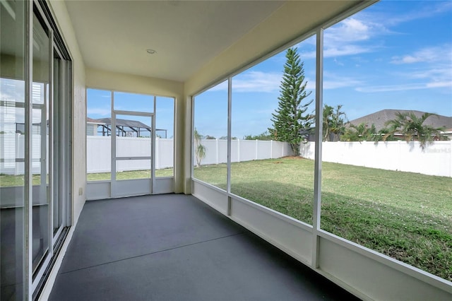 unfurnished sunroom featuring plenty of natural light