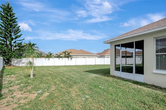 view of yard featuring a sunroom