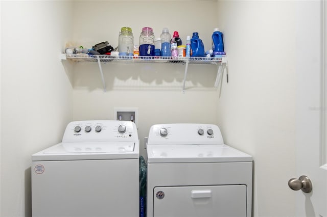 clothes washing area with washing machine and clothes dryer