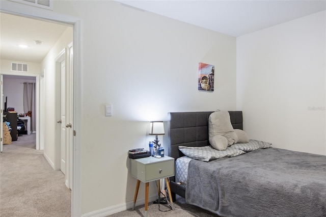 bedroom featuring light colored carpet