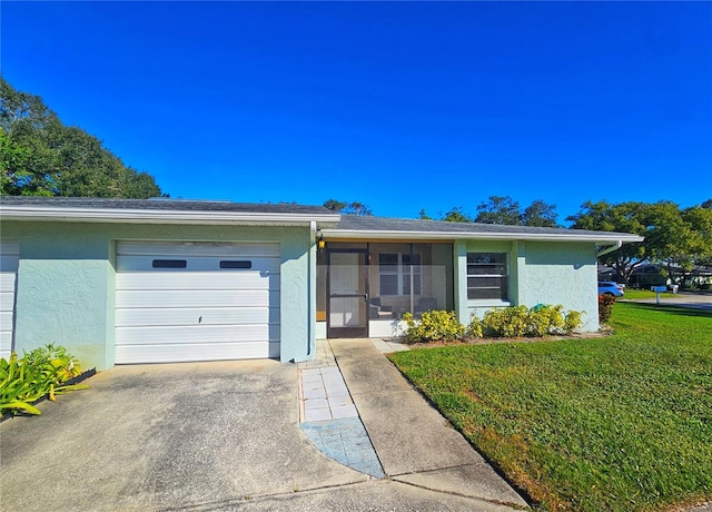 ranch-style home with a garage and a front yard