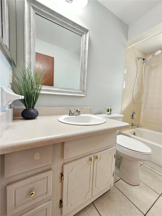 bathroom featuring tile patterned floors, vanity, toilet, and shower / bathtub combination