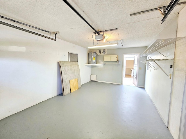 garage featuring water heater and a garage door opener