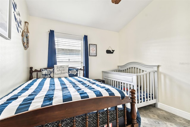 carpeted bedroom with ceiling fan and lofted ceiling