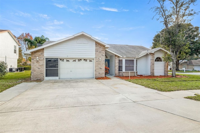 ranch-style home featuring a garage, central AC unit, and a front lawn