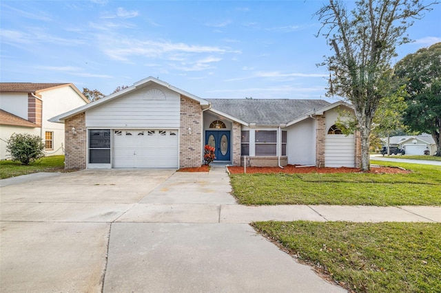 8404 Millwood Dr, Hudson, FL 34667 - view of front of property with an attached garage, concrete driveway, a front yard, and brick siding