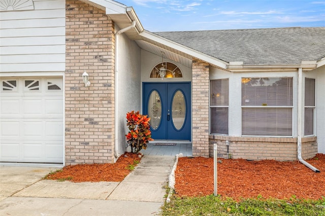 doorway to property featuring a garage