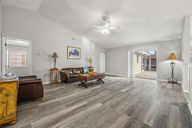 8404 Millwood Dr, Hudson, FL 34667 - living room featuring ceiling fan, lofted ceiling, wood finished floors, a textured ceiling, and baseboards