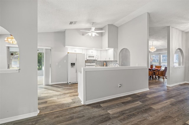 8404 Millwood Dr, Hudson, FL 34667 - kitchen with white appliances, a textured ceiling, white cabinetry, ceiling fan, and a peninsula