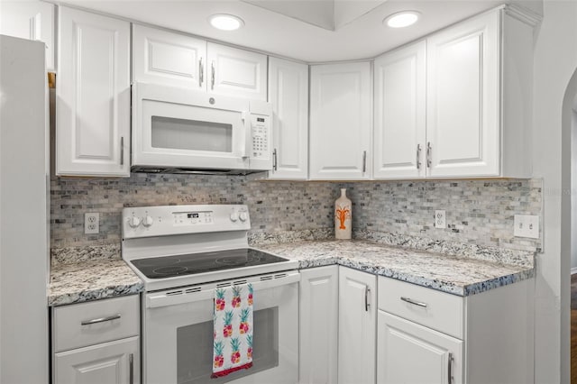 8404 Millwood Dr, Hudson, FL 34667 - kitchen featuring white appliances, white cabinets, backsplash, and recessed lighting