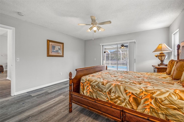 8404 Millwood Dr, Hudson, FL 34667 - bedroom with access to outside, wood finished floors, multiple windows, a textured ceiling, and baseboards