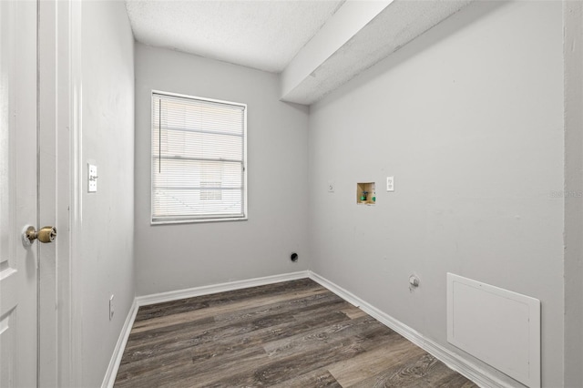 8404 Millwood Dr, Hudson, FL 34667 - laundry room featuring hookup for a washing machine, dark wood-style floors, baseboards, a textured ceiling, and hookup for an electric dryer