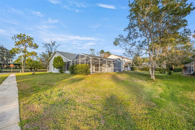 8404 Millwood Dr, Hudson, FL 34667 - view of grassy yard with glass enclosure