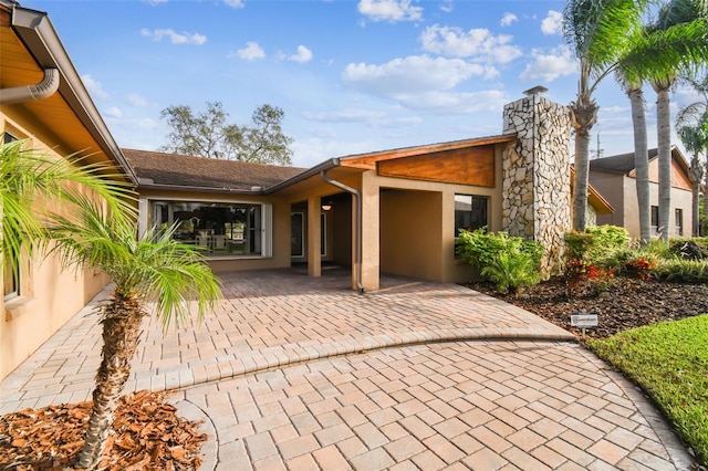 back of house featuring a patio area