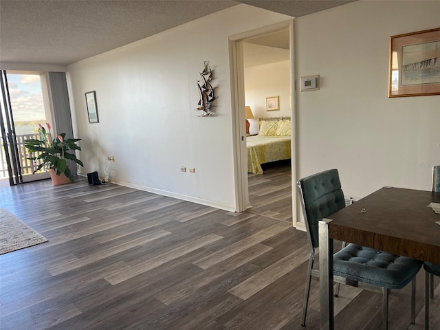 office featuring dark hardwood / wood-style flooring and a textured ceiling