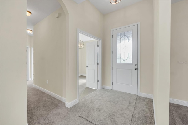 view of carpeted entrance foyer