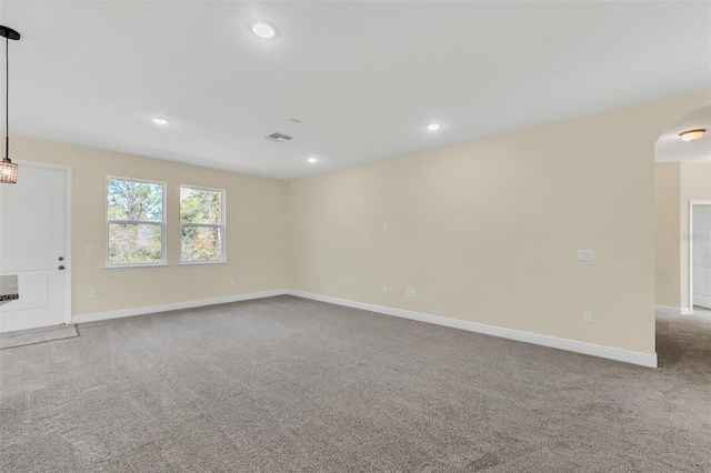 unfurnished room with light colored carpet